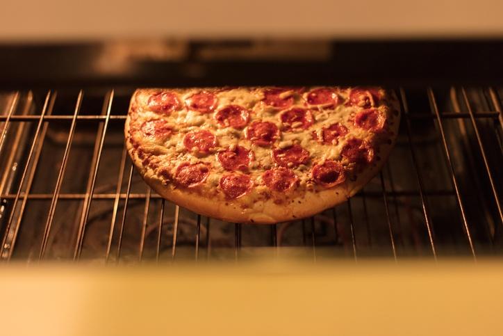 cooked pizza in oven